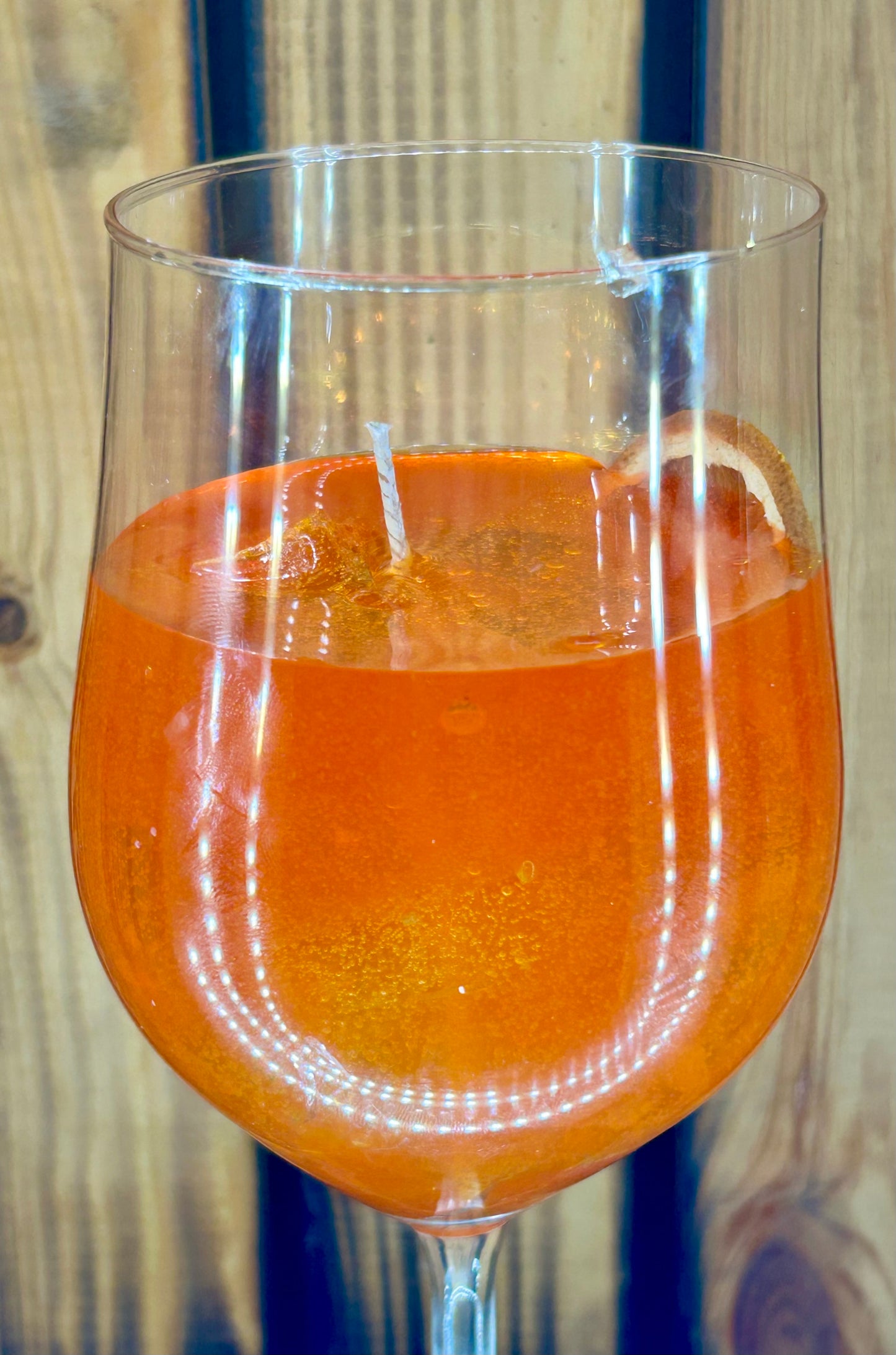 Feierliche Orangen Getränk Kerze